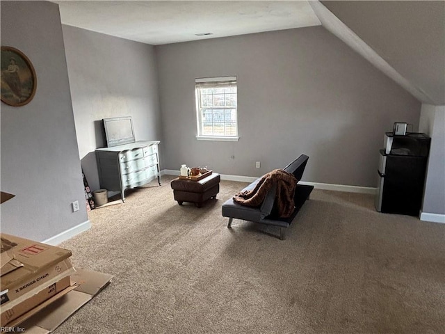 living area with carpet flooring and lofted ceiling