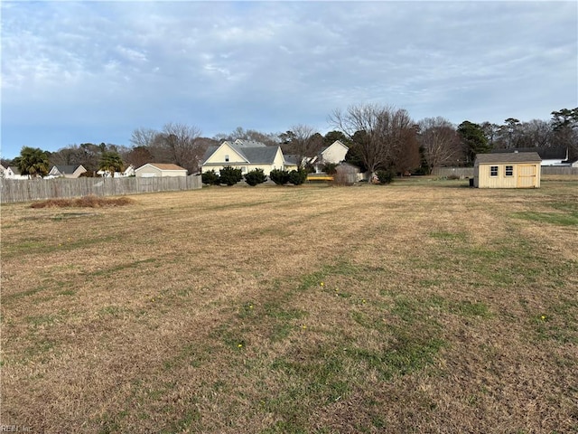 view of yard with a storage unit