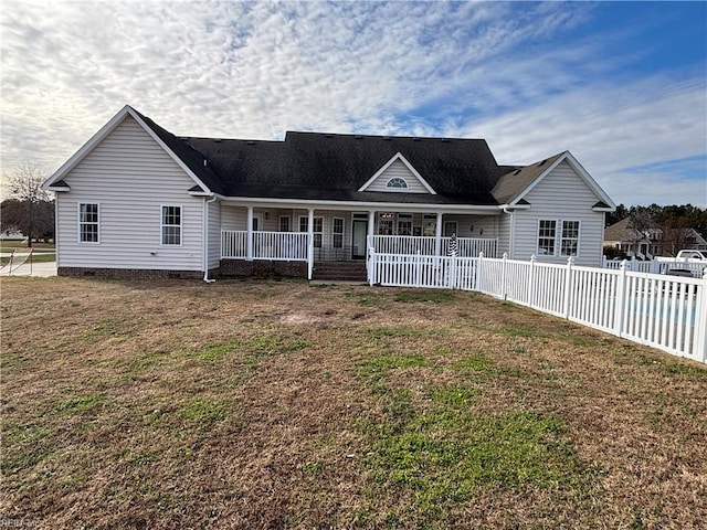 view of front of property with covered porch and a front lawn