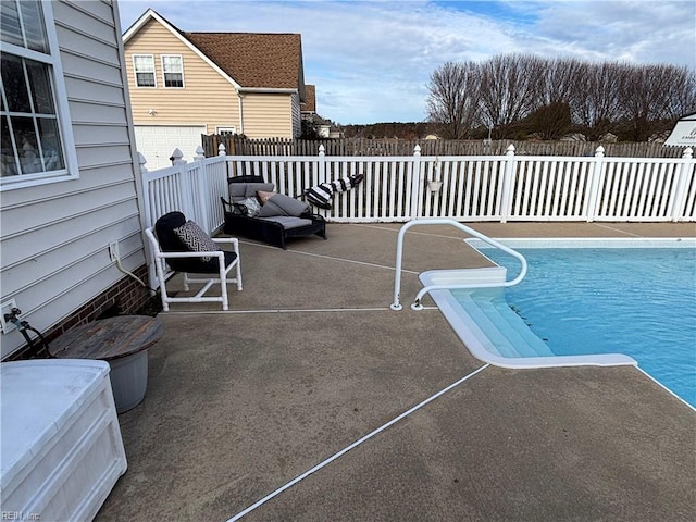 view of pool featuring a patio area