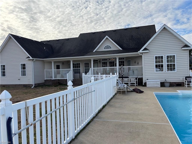 rear view of house featuring a patio