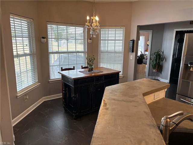 dining area with an inviting chandelier