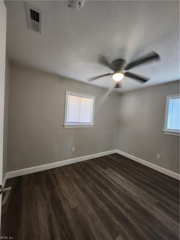 spare room featuring dark hardwood / wood-style floors