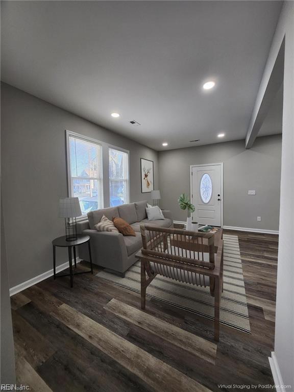 living room featuring dark hardwood / wood-style flooring