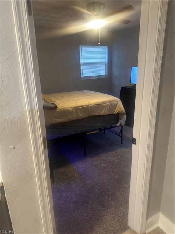 bedroom with ceiling fan and carpet