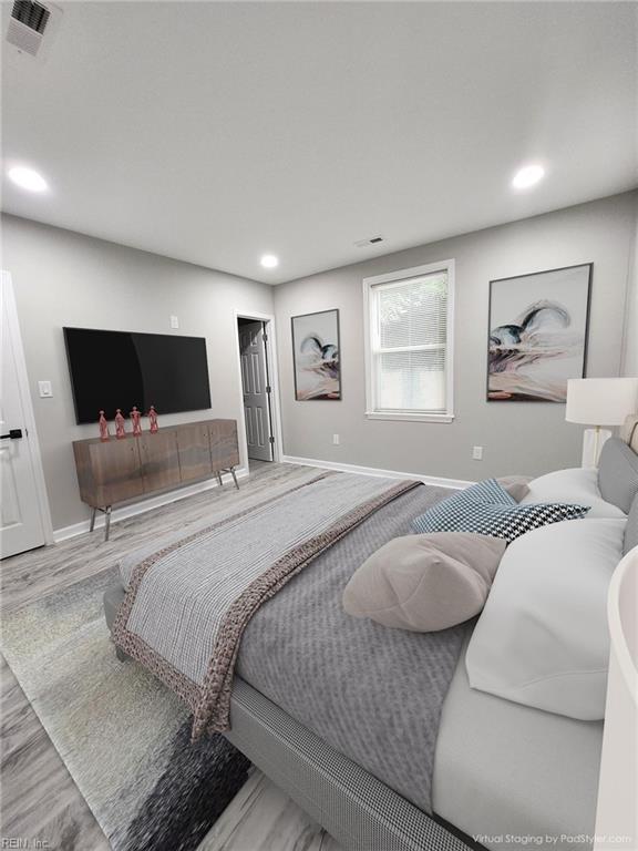 bedroom featuring hardwood / wood-style floors