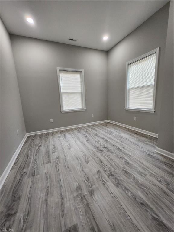 spare room with light hardwood / wood-style floors