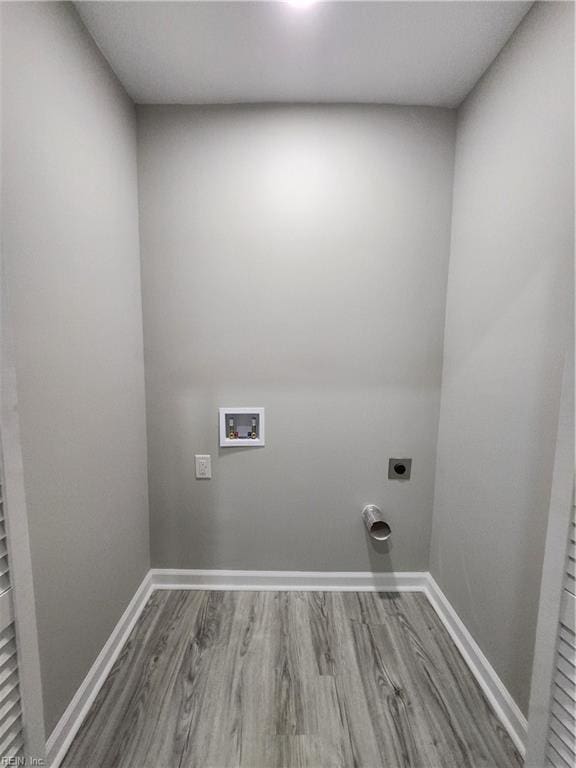 laundry room with hookup for a washing machine, electric dryer hookup, and wood-type flooring