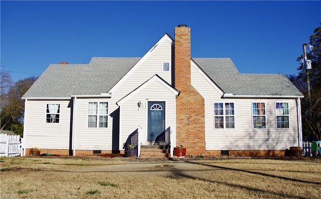 back of house with a lawn