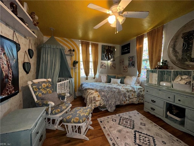 bedroom with hardwood / wood-style floors and ceiling fan