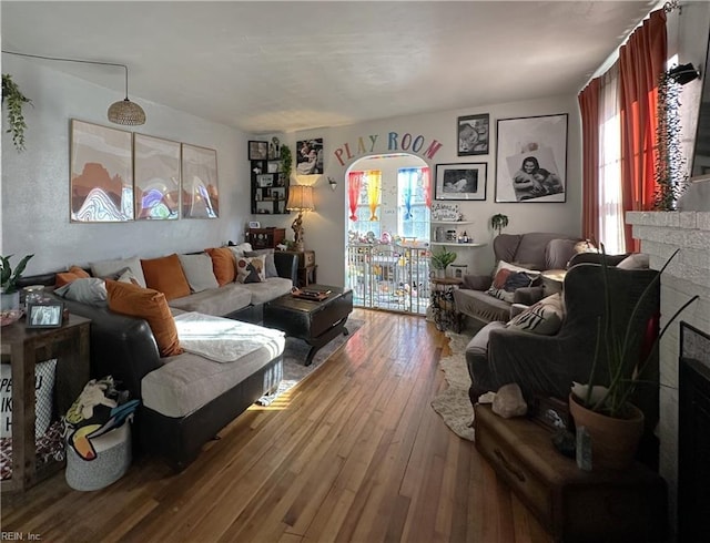 living room featuring a fireplace and hardwood / wood-style floors