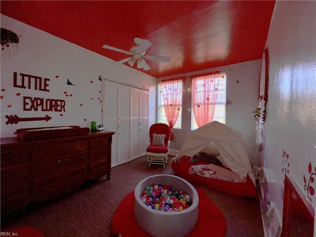 bedroom with ceiling fan and a closet