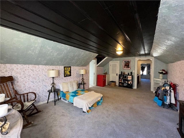 bedroom featuring carpet flooring and vaulted ceiling