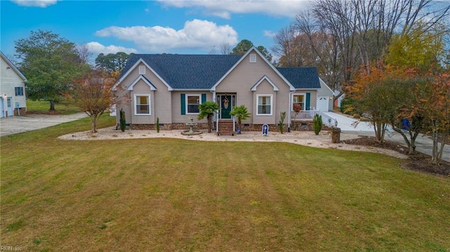 view of front of home with a front lawn and a garage