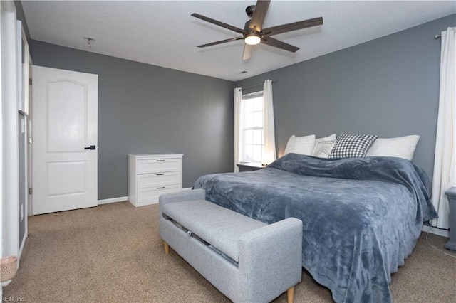 bedroom with ceiling fan and carpet floors