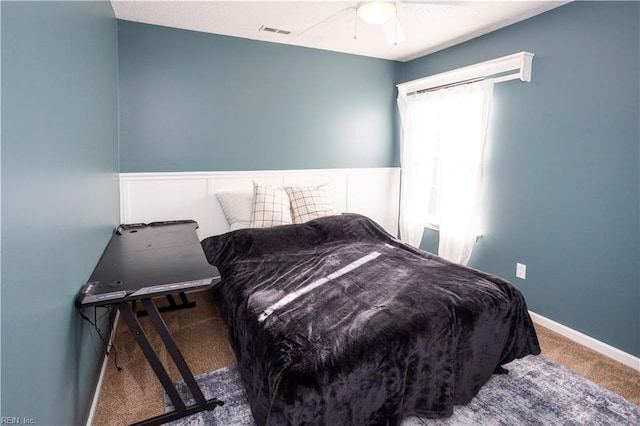 carpeted bedroom featuring ceiling fan