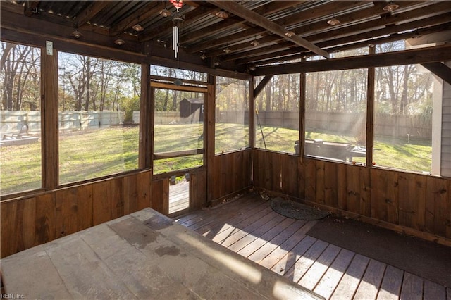 unfurnished sunroom featuring a wealth of natural light