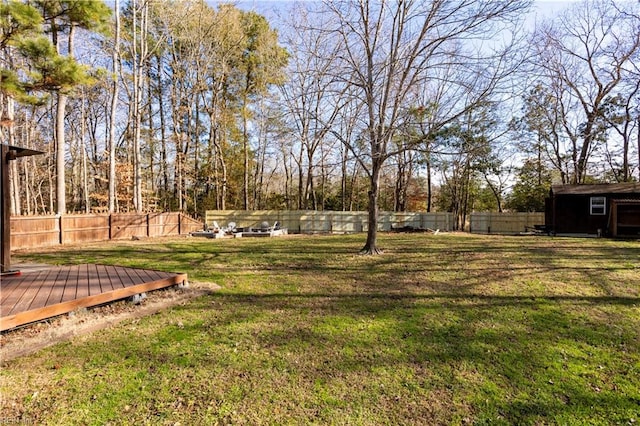 view of yard featuring a wooden deck