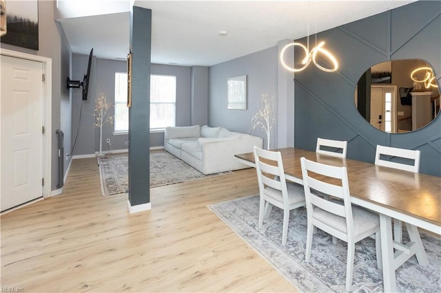 dining room featuring light hardwood / wood-style floors