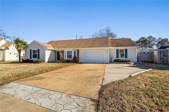 ranch-style home featuring a front yard and a garage