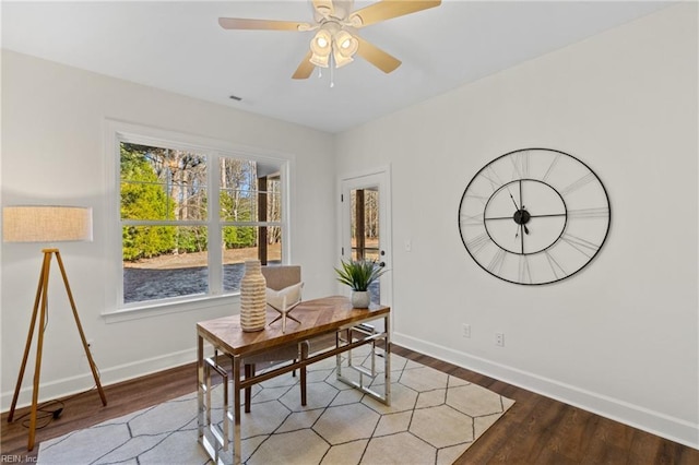 home office with hardwood / wood-style flooring and ceiling fan