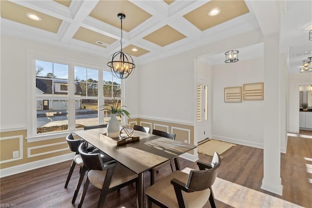 dining space with beamed ceiling, dark wood-type flooring, coffered ceiling, and an inviting chandelier