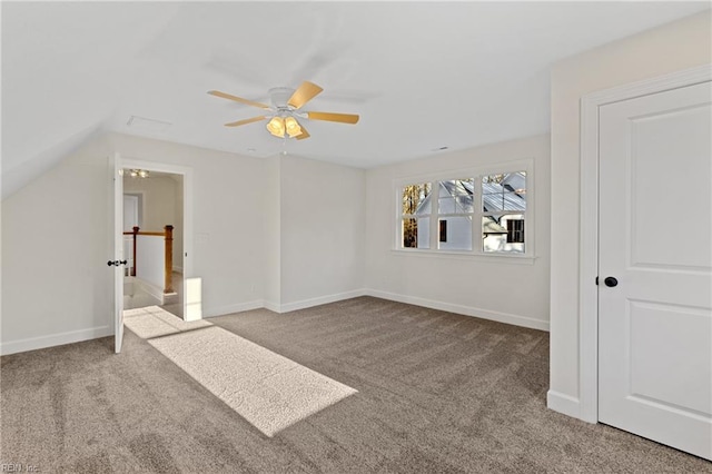 additional living space with carpet floors, vaulted ceiling, and ceiling fan