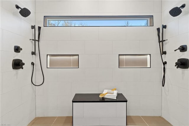 bathroom with tiled shower