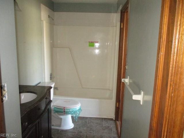 full bathroom with vanity, toilet, and shower / washtub combination