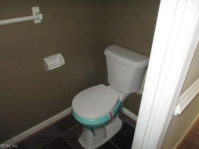 bathroom with tile patterned floors and toilet