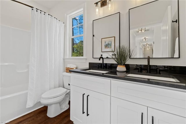 full bathroom with shower / bathtub combination with curtain, vanity, toilet, and wood-type flooring