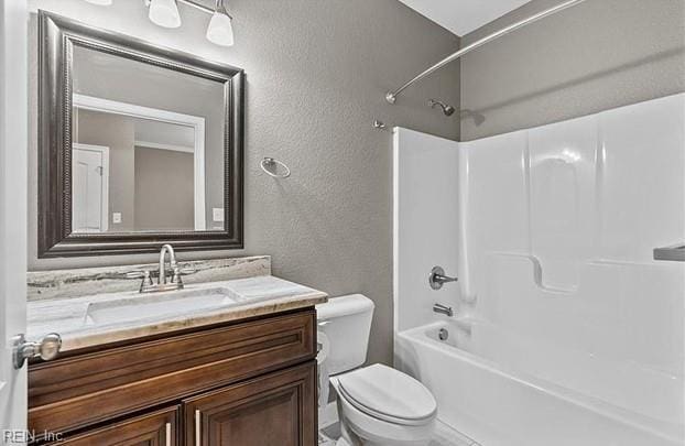 full bathroom with shower / washtub combination, vanity, and toilet