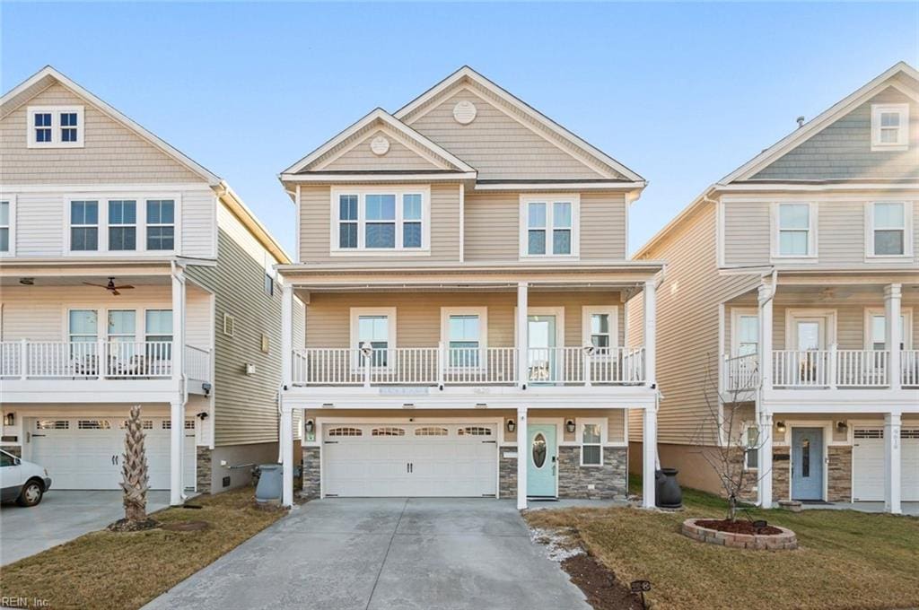 view of front of home with a garage and a front lawn