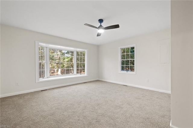 carpeted empty room with ceiling fan