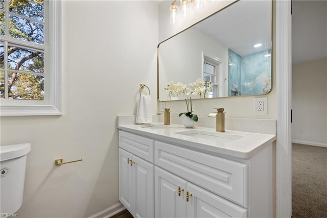 bathroom with vanity and toilet