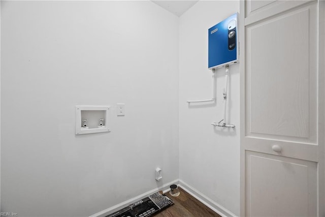 washroom with hardwood / wood-style floors and washer hookup