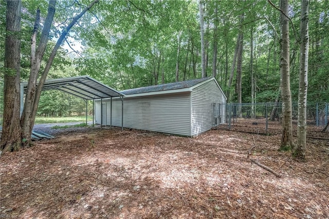 view of outbuilding with a carport