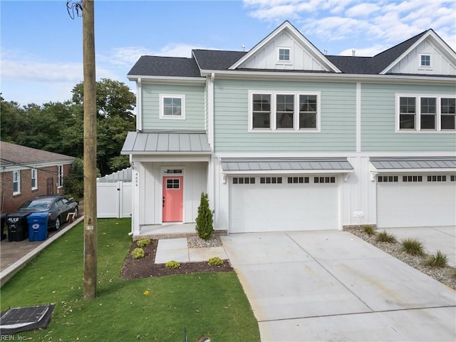 view of front facade featuring a garage and a front lawn