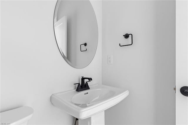 bathroom with toilet and sink