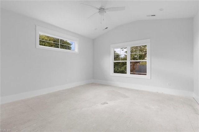 spare room featuring vaulted ceiling, ceiling fan, and a healthy amount of sunlight