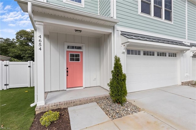 view of exterior entry featuring a garage