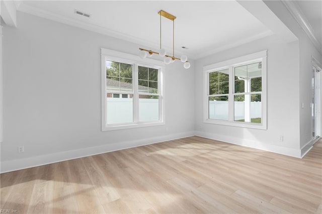 unfurnished dining area with ornamental molding, light wood-type flooring, and a notable chandelier