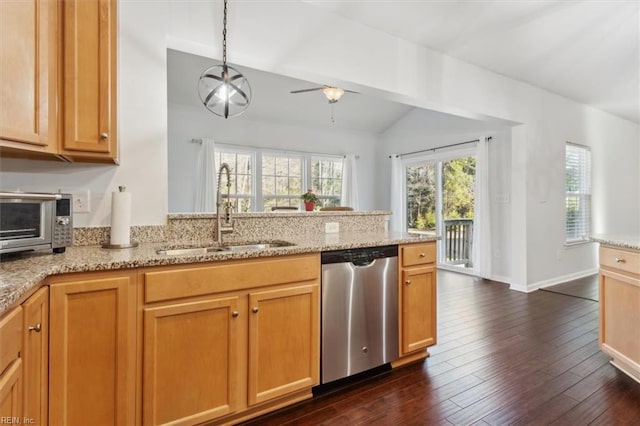 kitchen featuring light stone countertops, dark hardwood / wood-style flooring, stainless steel dishwasher, sink, and pendant lighting