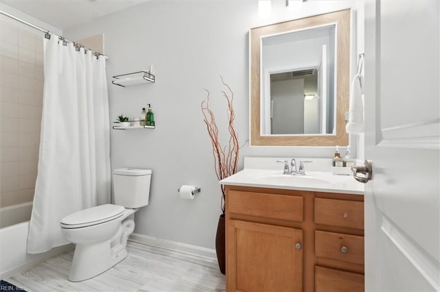 full bathroom featuring shower / tub combo with curtain, vanity, and toilet