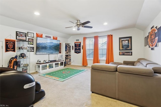 carpeted living room featuring ceiling fan and lofted ceiling