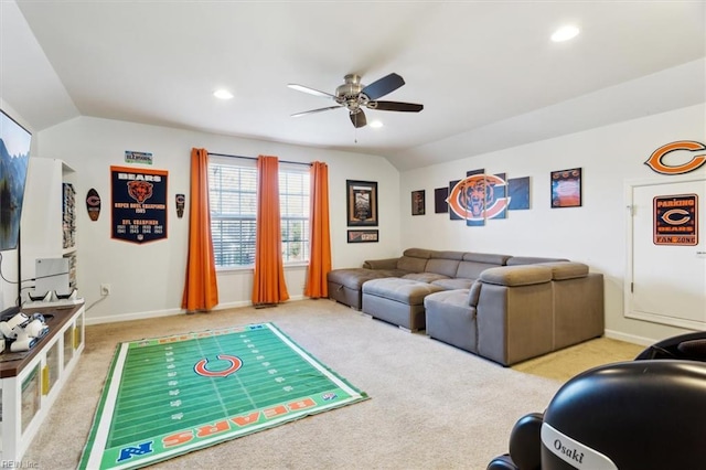 carpeted living room featuring ceiling fan and lofted ceiling