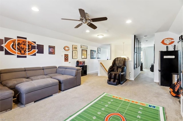 living room featuring light colored carpet and ceiling fan