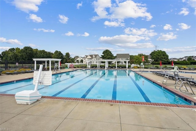 view of swimming pool featuring a pergola and a patio