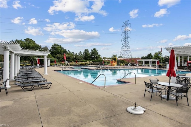 view of swimming pool featuring a pergola and a patio area