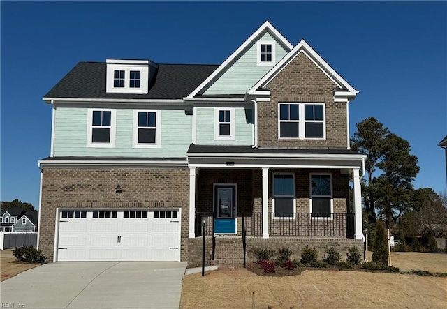 craftsman-style house with a garage and covered porch